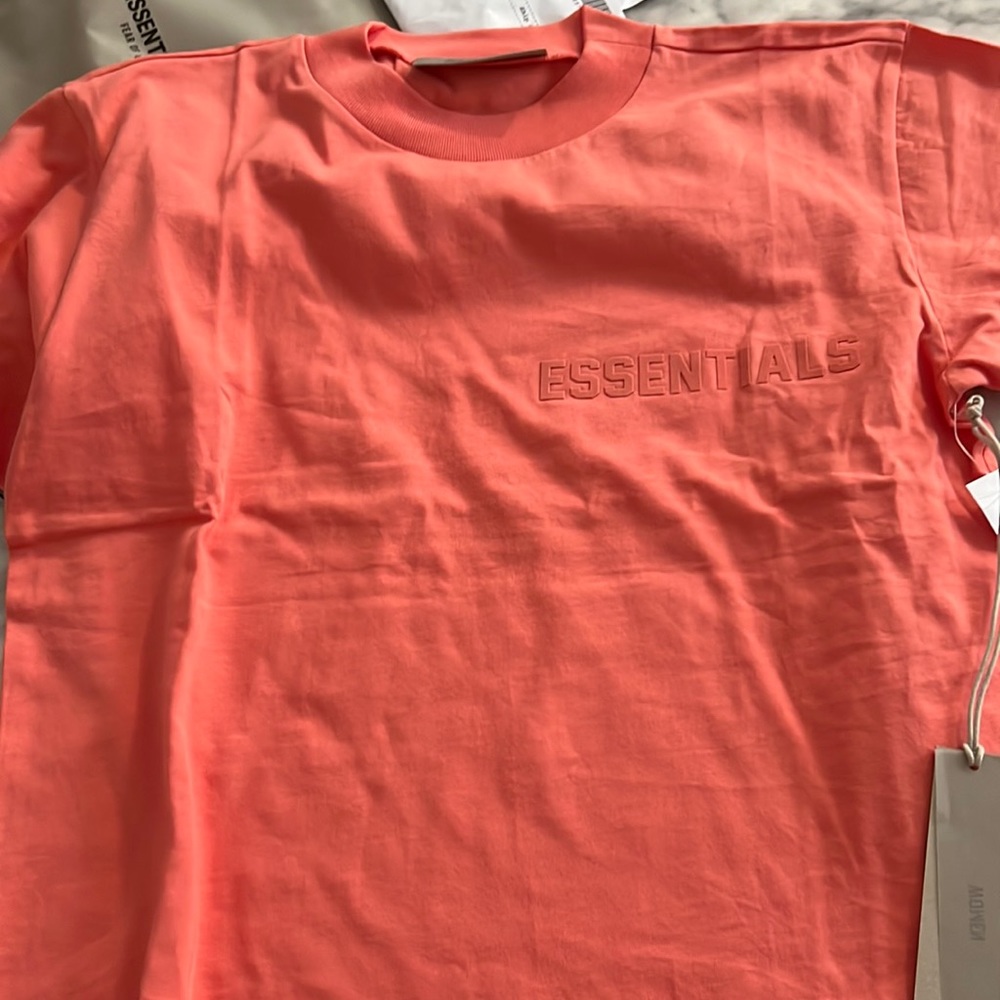 Essentials women coral tshirt size medium never worn